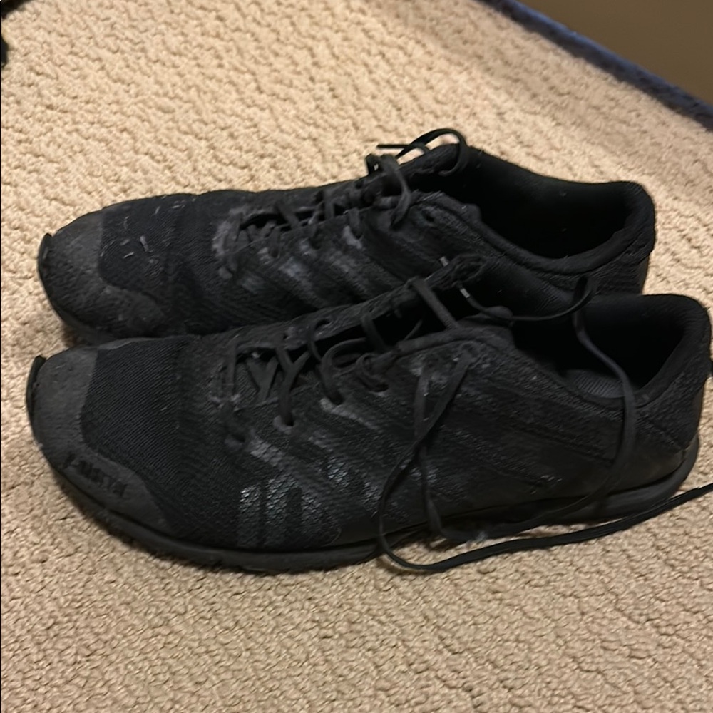 Inov-8 Black Athletic Shoes Sleek Design